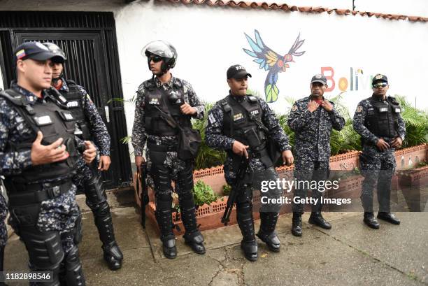 The Bolivarian national police guard the Bolivian embassy in Los Palos Grandes, Caracas during a rally "Wake up Venezuela" called by Venezuelan...