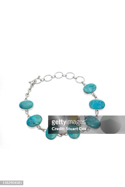 turquoise and silver bracelet on a white background. - silver bracelet stock pictures, royalty-free photos & images