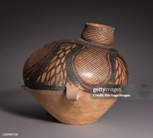 Bird-shaped Urn, 2650-2350 BC. An imaginative shape and abstract curvilinear patterns lend delightful charm to this functional jar. Its fine-grained...