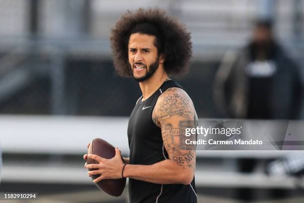 Colin Kaepernick looks to make a pass during a private NFL workout held at Charles R Drew high school on November 16, 2019 in Riverdale, Georgia. Due...