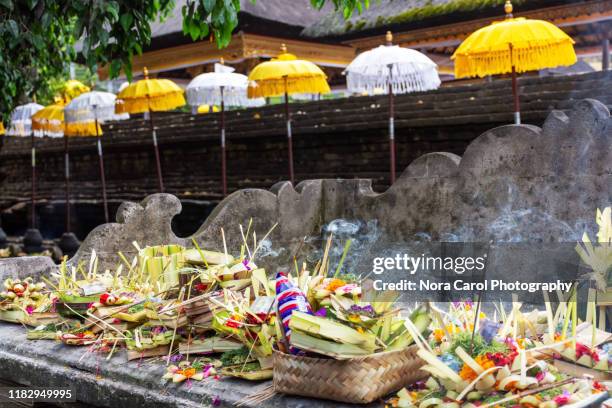 balinese temple offering - tirta empul temple stock pictures, royalty-free photos & images