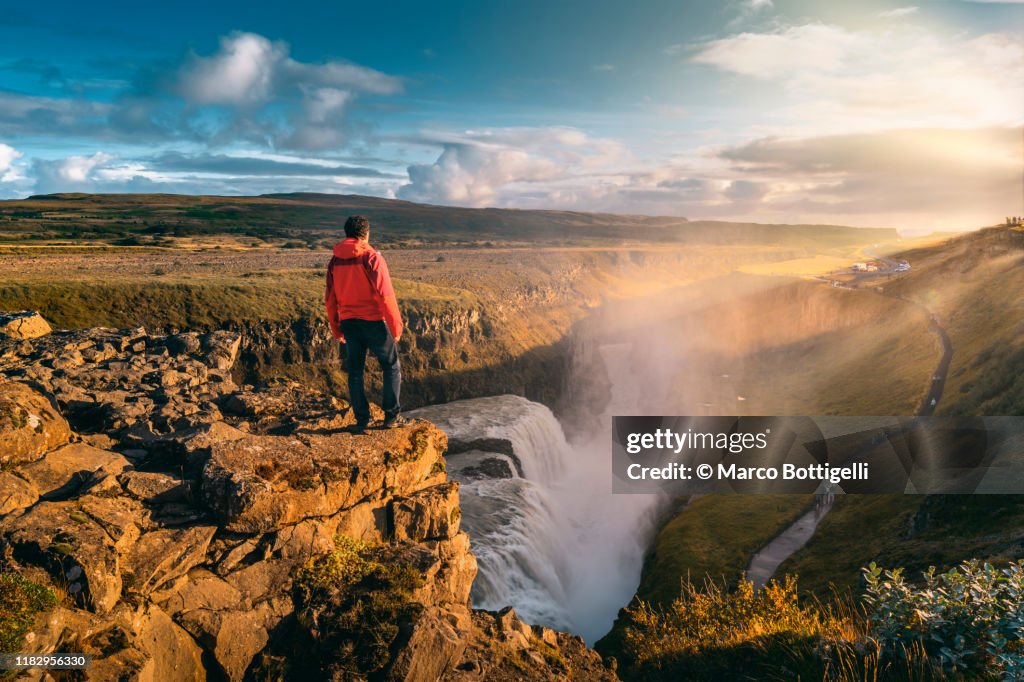 One man standing on top of Gullfoss waterfall, Iceland
