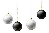 Realistic black and white  Christmas balls hanging on gold beads chains on white  background