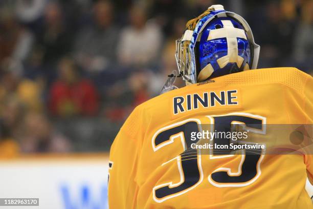 The artwork on the back of the mask of Nashville Predators goalie Pekka Rinne is shown during the NHL game between the Nashville Predators and...