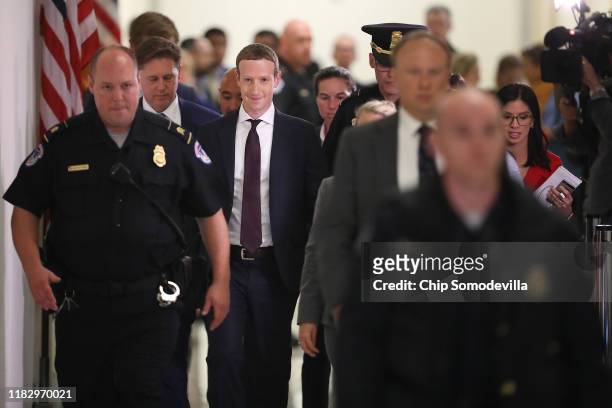 Facebook co-founder and CEO Mark Zuckerberg leaves the Rayburn House Office Building after testifying before the House Financial Services Committee...