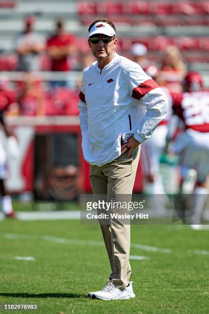 Head Coach Chad Morris of the Arkansas Razorbacks watches his team warm up before a game against the Colorado State Rams at Razorback Stadium on...
