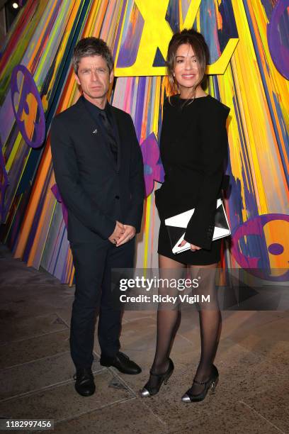 Noel Gallagher and Sara MacDonald seen attending Louis Vuitton Maison - store launch party on October 23, 2019 in London, England.