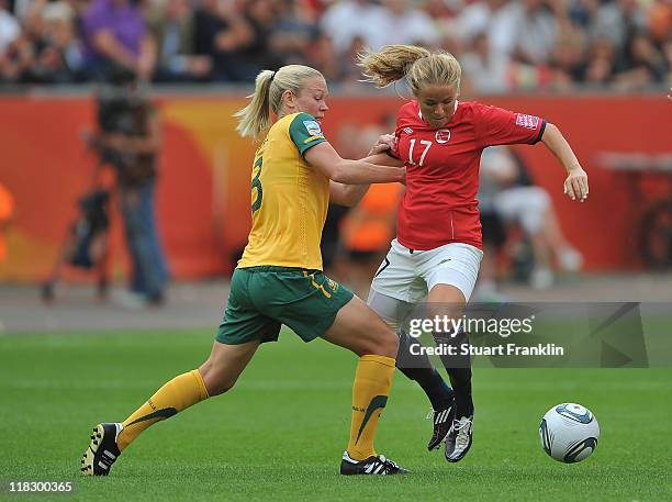 Lene Mykjaland of Norway is challenged by Kim Carroll of Australia during the FIFA Women's World Cup 2011 group D match between Australia and Norway...