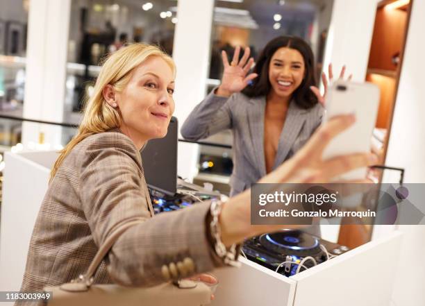 Kelly Rutherford and Hannah Bronfman take a selfie at the Patrick McMullan x Lafayette 148 New York Madison Avenue opening event at the Lafayette 148...