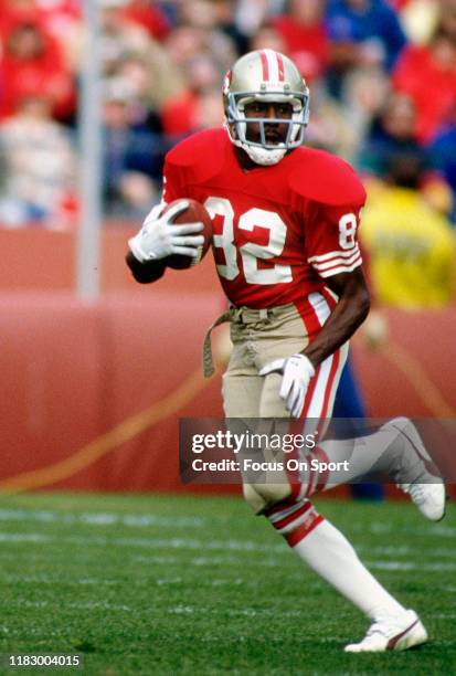 John Taylor of the San Francisco 49ers returns a punt against the Buffalo Bills during an NFL football game December 17, 1989 at Candlestick Park in...