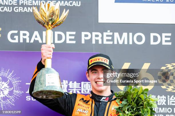 Motorsport driver Richard Verschoor of Netherlands poses for photo with trophy after winning the formula 3 Macau Grand Prix - FIA F3 world cup on day...