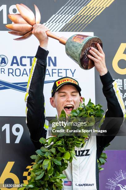 Carlin Buzz Racing driver Logan Sargeant of United States poses for photo with trophy after finished in third place of the formula 3 Macau Grand Prix...