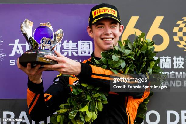 Motorsport driver Richard Verschoor of Netherlands poses for photo with trophy after winning the formula 3 Macau Grand Prix - FIA F3 world cup on day...