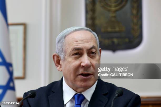 Israeli Prime Minister Benjamin Netanyahu opens the weekly cabinet meeting at his Jerusalem office on November 17, 2019.