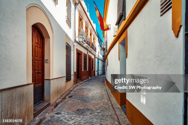 colorful old street in cordoba, spain - córdoba spanje stockfoto's en -beelden