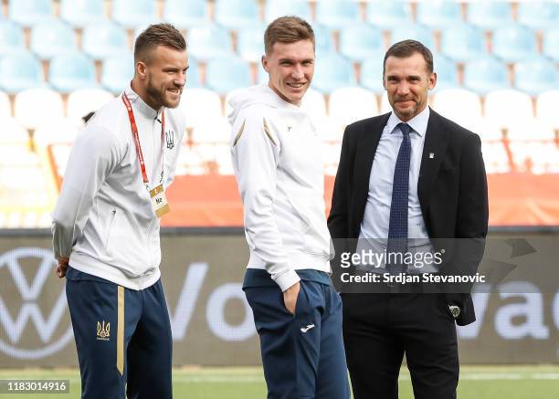 Andriy Yarmolenko Yevhen Konoplyanka and head coach Andriy Shevchenko of Ukraine smile prior to the UEFA Euro 2020 Qualifier between Serbia and...