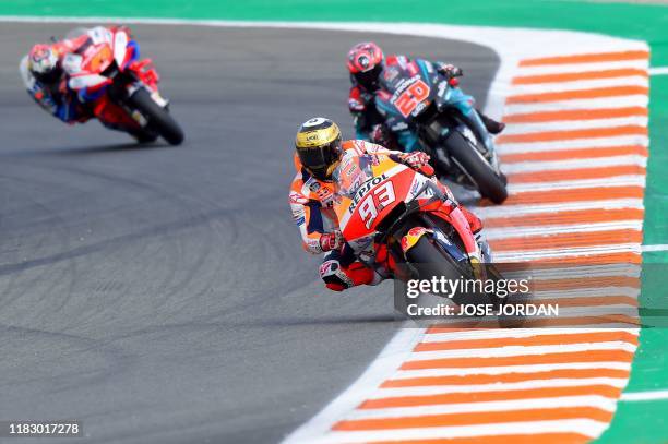 Repsol Honda Team's Spanish rider Marc Marquez rides ahead Petronas Yamaha SRT's French rider Fabio Quartararo during the MotoGP race of the MotoGP...