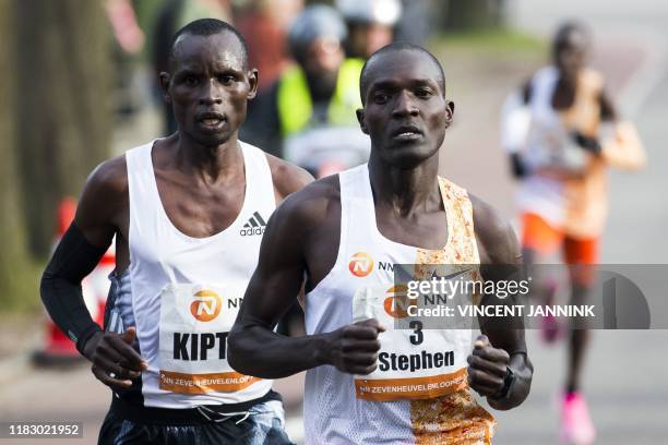 Ouganda's athlete Stephen Kissa runs ahead of Kenyan athlete Edwin Kiptoo during the 36th edition of the 15-kilometer long Zevenheuvelenloop in...