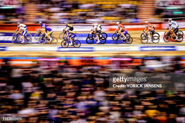 Track riders compete during the Zesdaagse Vlaanderen-Gent six-day indoor cycling race at the 't Kuipke ' cycling arena, on November 17, 2019 in Gent....