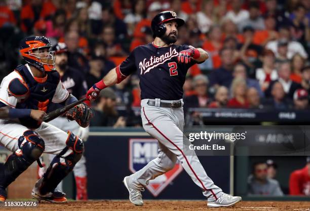 Adam Eaton of the Washington Nationals hits his two-run home run against the Houston Astros during the eighth inning in Game Two of the 2019 World...