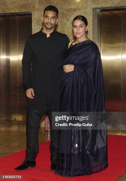 Indian actor Angad Bedi and Neha Dhupia attend film producer Ramesh Taurani's Diwali bash on October 23, 2019 in Mumbai, India.