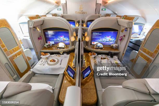 Prepared meals sit on display in the first class cabin of an Airbus SE A380-800 aircraft operated by Emirates Airline, during the first day of the...