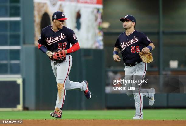 Juan Soto and Gerardo Parra of the Washington Nationals celebrate their 12-3 win over the Houston Astros in Game Two of the 2019 World Series at...