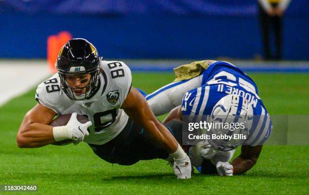 Josh Oliver of the Jacksonville Jaguars makes a first down catch during the first quarter of the game against the Indianapolis Colts at Lucas Oil...