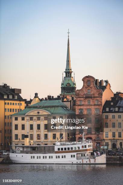 gamla stan (old town) skyline at sunset with german church (tyska kyrkan) in central stockholm, sweden - stockholm ストックフォトと画像