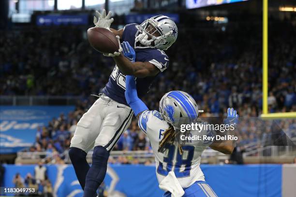 Michael Gallup of the Dallas Cowboys makes a catch in the second quarter of the game against the Mike Ford of the Detroit Lions at Ford Field on...