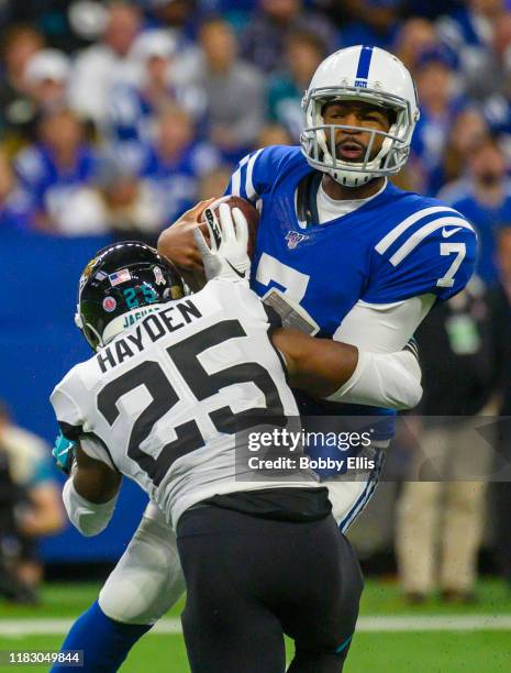 Jacoby Brissett of the Indianapolis Colts is sacked by D.J. Hayden of the Jacksonville Jaguars during the second quarter of the game at Lucas Oil...
