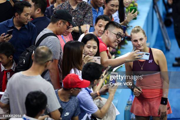 Dayana Yastremska of Ukraine and fans take selfies after Singles group match against Donna Vekic of Croatia on Day two of 2019 WTA Elite Trophy...