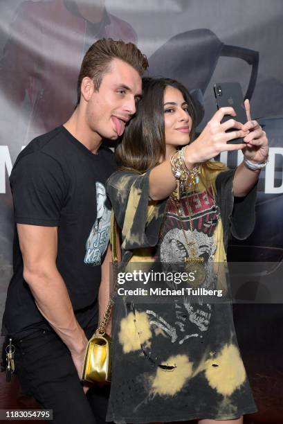 James Kennedy takes a selfie with a fan at the Los Angeles launch party for JamesKennedy.shop at SUR Lounge on October 23, 2019 in Los Angeles,...