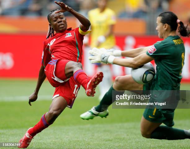 Andreia of Brazil and Genoveva Anonman Nze of Equatorial Guinea battle for the ball during the FIFA Women's World Cup 2011 Group D match between...
