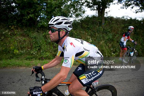 Stage winner, Britain's Mark Cavendish rides the 164.5 km and fifth stage of the 2011 Tour de France cycling race run between Carhaix and Cap Frehel,...