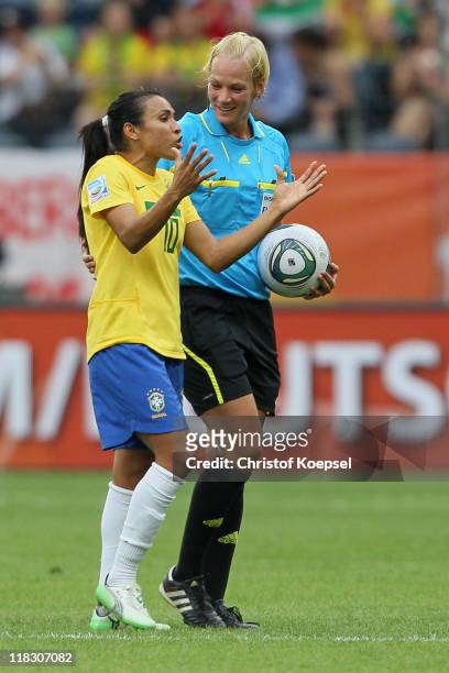 Marta of Brazil discusses with referee Bibiana Steinhaus of Germany during the FIFA Women's World Cup 2011 Group D match between Equatorial Guinea...