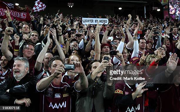 The Maroons crowd cheer their players on the victory lap during game three of the ARL State of Origin series between the Queensland Maroons and the...