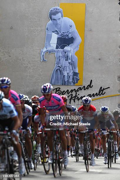 The peloton passes through Yffiniac the home town of racing legend Bernard Hinault during Stage 5 of the 2011 Tour de France from Carhaix to Cap...