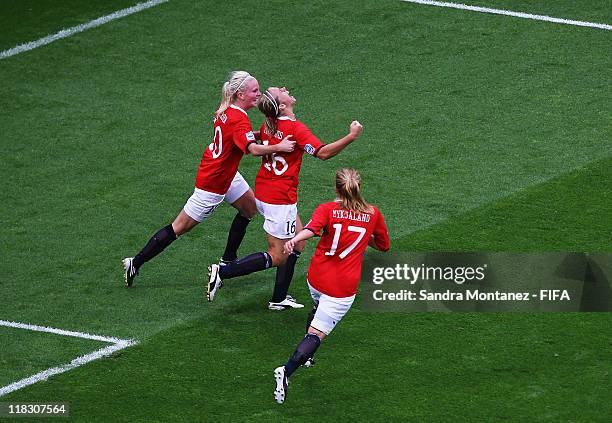 Elise Thorsnes of Norway celebrates with team mates Cecilie Pedersen and Lene Mykjaland after scoring the first goal during the FIFA Women's World...