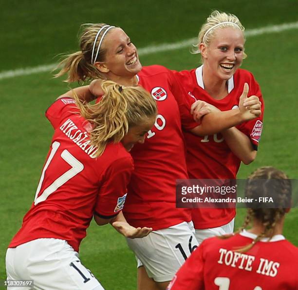 Elise Thorsnes of Norway celebrates her first goal with teammates Lene Mykjaland and Cecilie Pedersen during the FIFA Women's World Cup group D match...