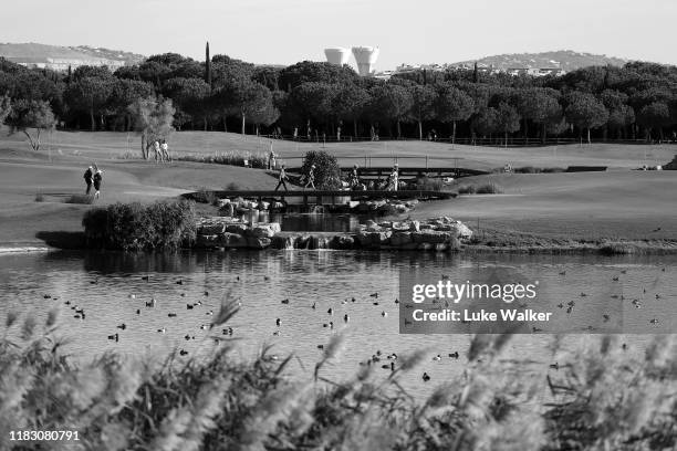 General view of golfers crossing a bridge on the 14th hole during Day One of the Portugal Masters at Dom Pedro Victoria Golf Course on October 24,...