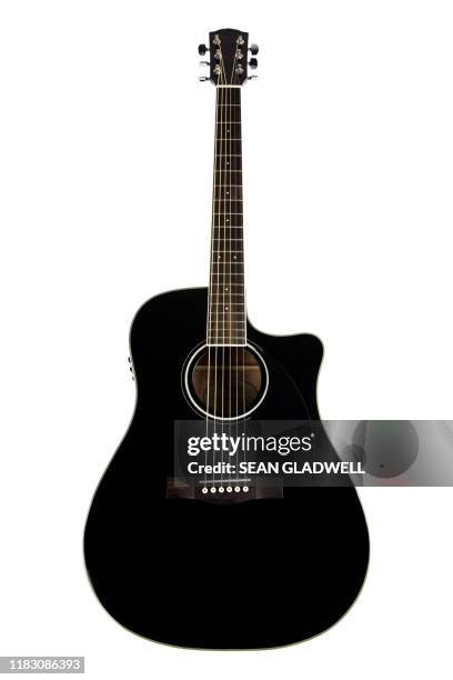 isolated acoustic guitar - akustikgitarre stock-fotos und bilder