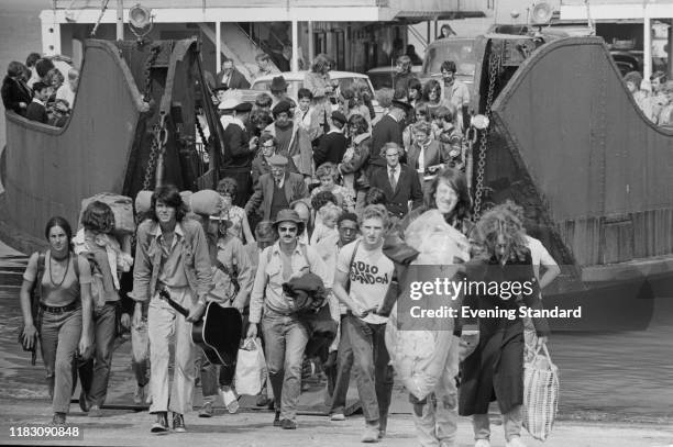 Festival-goers getting of the ferry to attend the Isle of Wight Festival, Afton Down, UK, 26th-31st August 1970.
