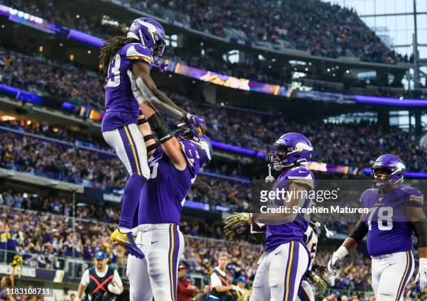 Dalvin Cook of the Minnesota Vikings celebrates after scoring a touchdown in the fourth quarter of the game against the Denver Broncos at U.S. Bank...