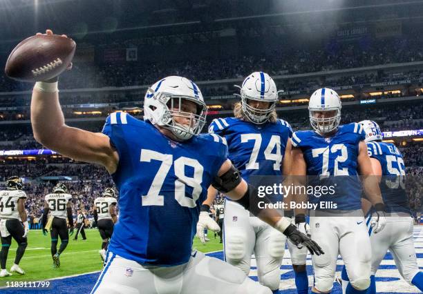 Ryan Kelly of the Indianapolis Colts spikes the ball after an Indianapolis Colts touchdown in the third quarter of the game against the Jacksonville...