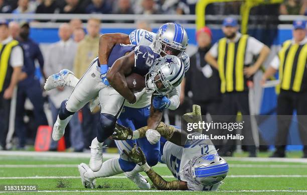 Randall Cobb of the Dallas Cowboys makes the catch for a first down during the fourth quarter of the game as Rashaan Melvin and Tracy Walker of the...