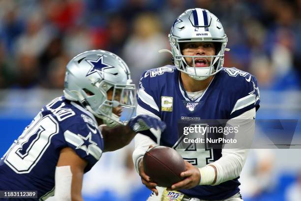 Dallas Cowboys quarterback Dak Prescott hands off the ball to Dallas Cowboys running back Tony Pollard during the first half of an NFL football game...