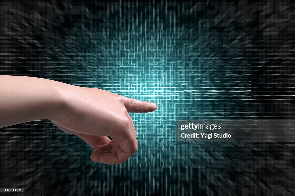 A woman's hand is touching a digital screen.