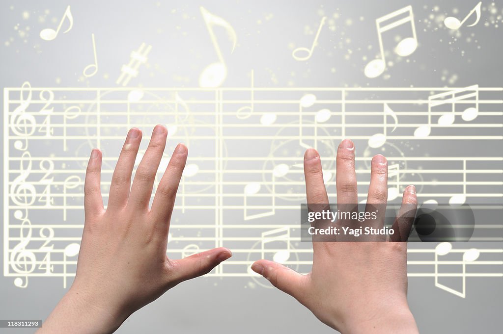 A woman's hands  operating on digital music