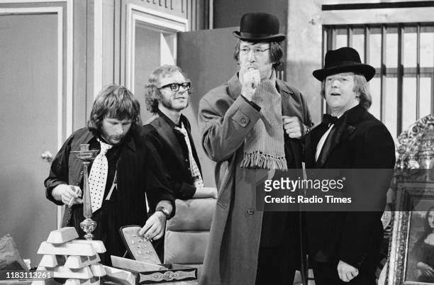 Comedic actors Bill Oddie, Graeme Garden, Jack Douglas and Tim Brooke-Taylor in a sketch from episode 'Goodies in the Nick' of the BBC television...